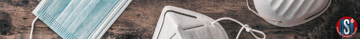 Disposable and N95-style dust masks laid out on a wooden surface, representing Skookum Tools' Zenith disposable mask category for breathing protection in dusty or low-exposure environments.